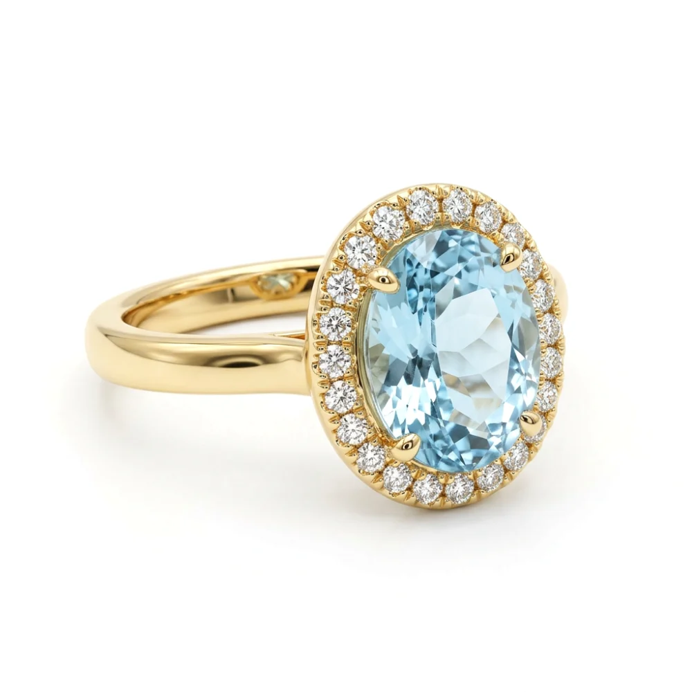 Anel em Ouro Amarelo 18k com Água-Marinha Oval e Halo de Diamantes